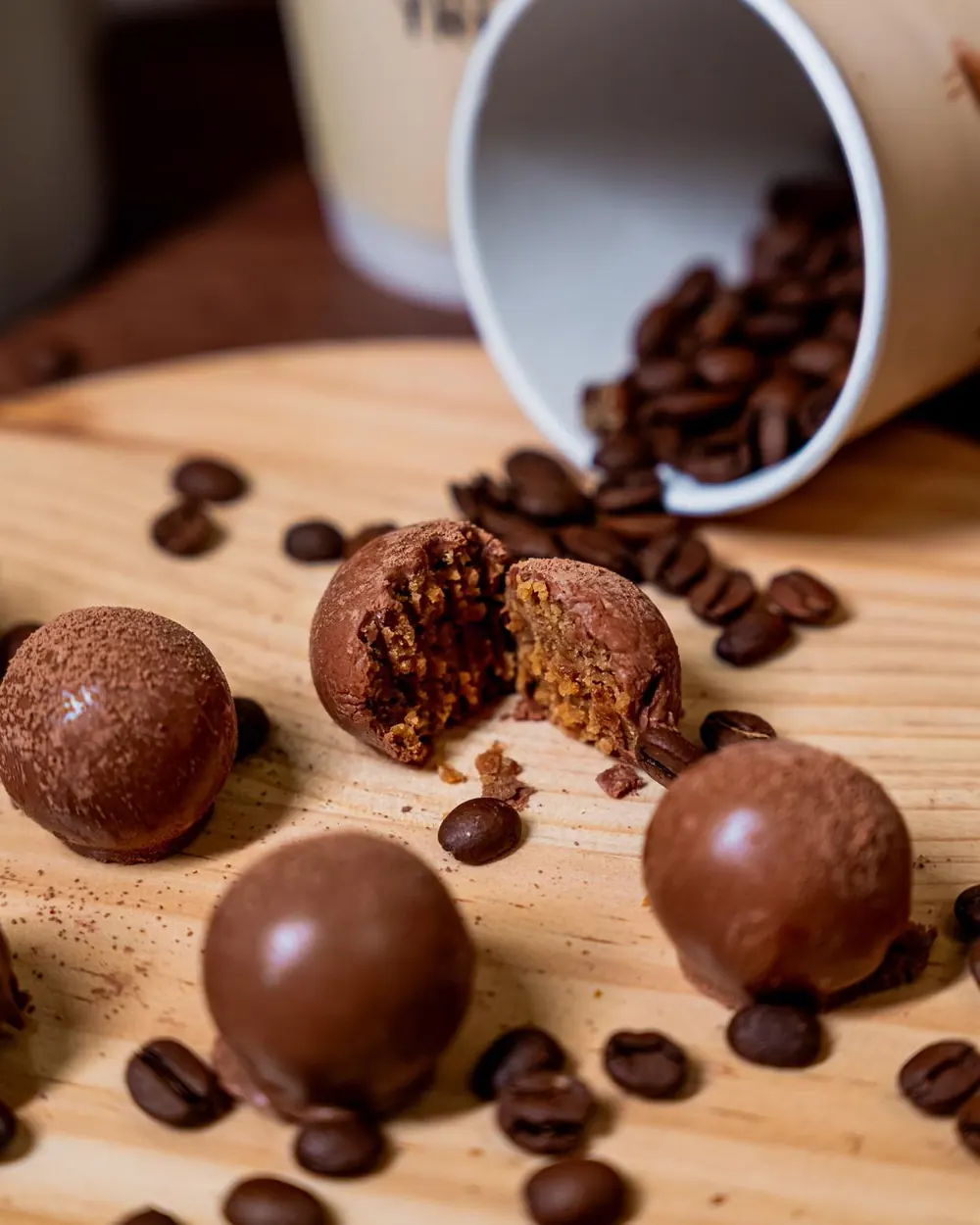 Truffle cut open among coffee beans
