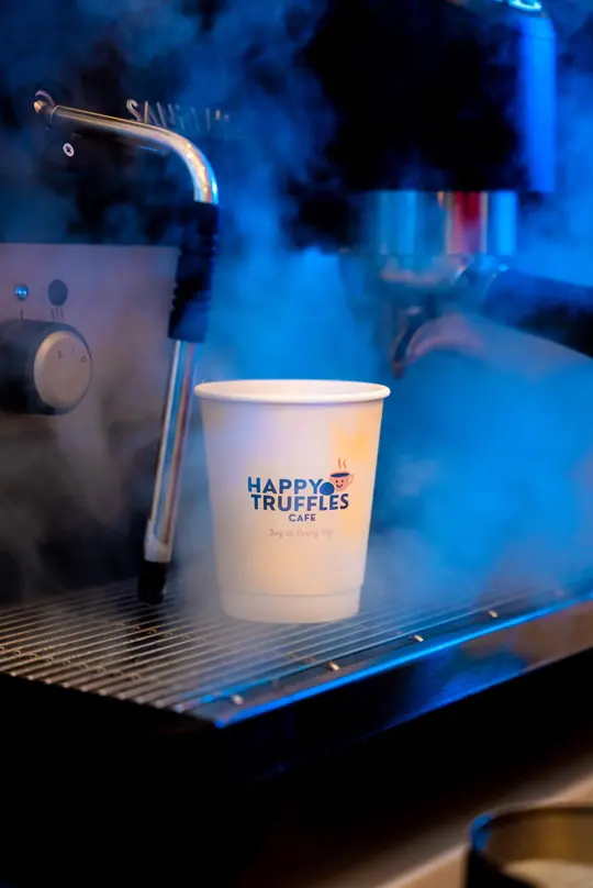 Coffee machine steaming a fresh cup