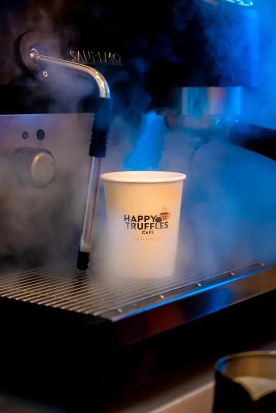 Barista steam and a Happy Truffles cup